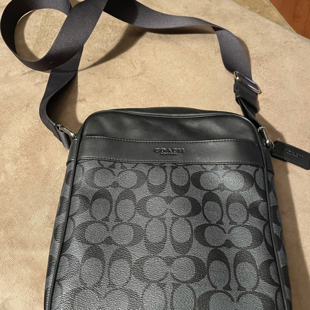 Unisex shoulder bag great black monogram style.